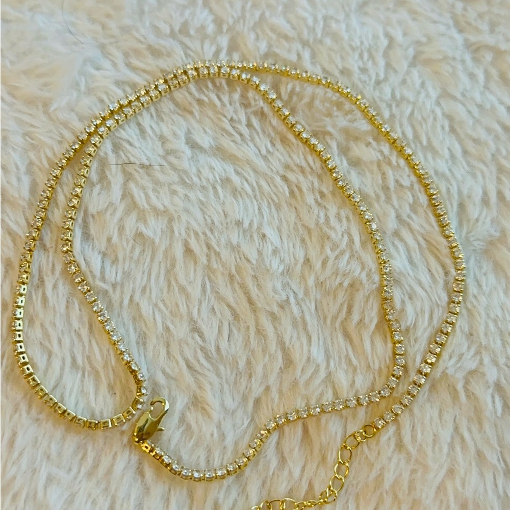 Trendy Tennis bracelet style necklace with clear round diamond cut stones.